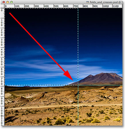 Menggambar rectangular selection di sekitar bagian kiri atas. Gambar © 2011 Photoshop Essentials.com