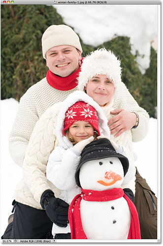 A photo of a family outdoors in winter. Image licensed from iStockphoto by Photoshop Essentials.com.