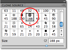 Selecting the third snowflake brush in the Brushes panel in Photoshop. Image © 2010 Photoshop Essentials.com.