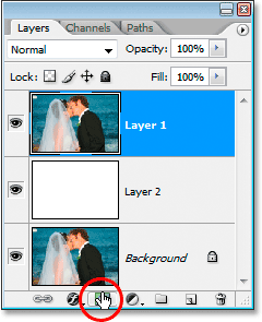 Clicking the 'Add Layer Mask' icon at the bottom of the Layers palette.