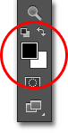 The Foreground and Background color swatches in the Tools panel. Image © 2012 Photoshop Essentials.com.