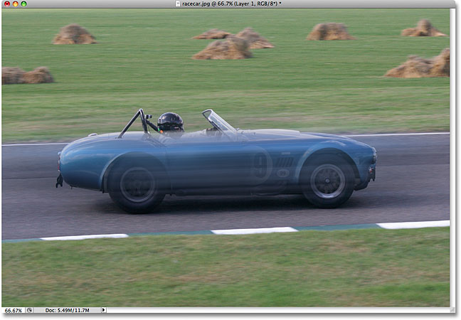 The image after applying the Motion Blur filter to the racecar. Image © 2009 Photoshop Essentials.com.