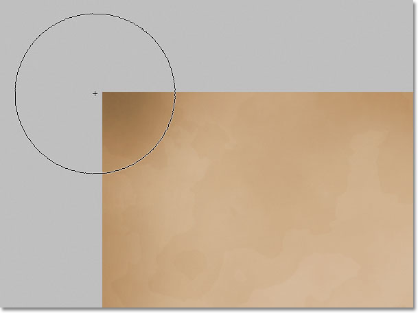 Darkening the paper edges with the Burn Tool in Photoshop. Image © 2011 Photoshop Essentials.com.