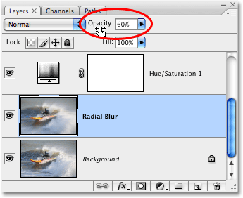 Menurunkan opacity dari lapisan Radial Blur di Photoshop. Gambar © 2008 Photoshop Essentials.com.