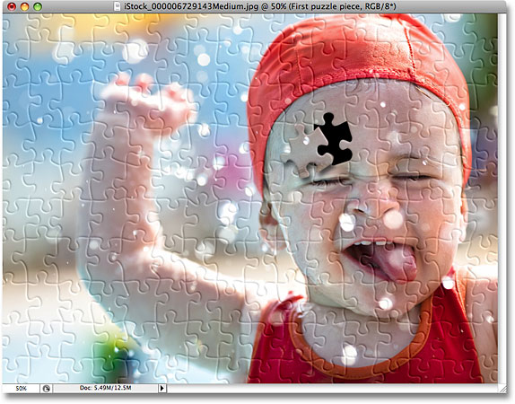 The photo after applying the drop shadow to the puzzle piece. Image © 2008 Photoshop Essentials.com.