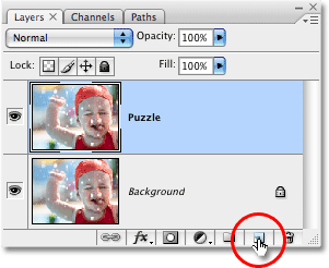 Clicking the New Layer icon in the Layers palette. Image © 2008 Photoshop Essentials.com.