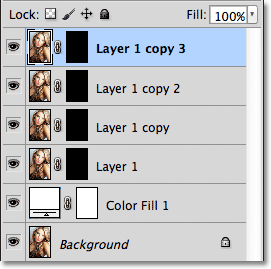 Four copies of the photo appear above the Solid Color fill layer. Image © 2011 Photoshop Essentials.