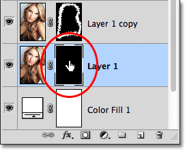 Selecting the layer mask on Layer 1. Image © 2011 Photoshop Essentials.