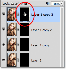 Clicking on the layer mask thumbnail for the top layer in the Layers panel. Image © 2011 Photoshop Essentials.