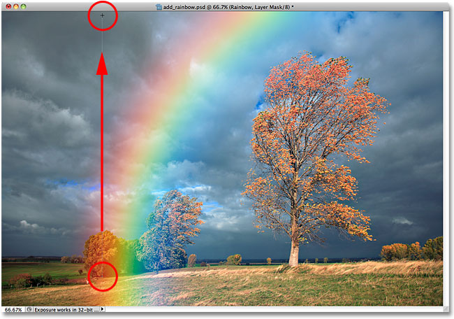 Dragging a black-to-white gradient from the base of the rainbow to the top of the image.