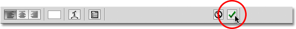 Clicking the checkmark to accept the text in Photoshop. Image © 2009 Photoshop Essentials.com.