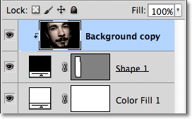 The Layers panel showing the Background copy layer clipped to the Shape layer. Image © 2011 Photoshop Essentials.com.