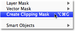 Selecting the Create Clipping Mask command from the Layer menu in Photoshop. Image © 2011 Photoshop Essentials.com.