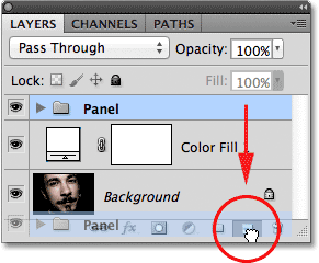 Dragging the layer group onto the New Layer icon. Image © 2011 Photoshop Essentials.com.