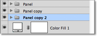 Moving the Panel copy 2 group below the Panel copy group. Image © 2011 Photoshop Essentials.com.