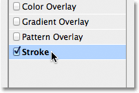 Selecting Stroke from the list of styles in the Layer Style dialog box. Image © 2011 Photoshop Essentials.com.