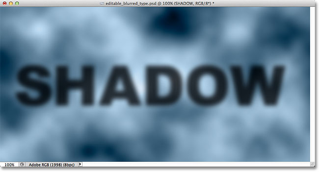 Teks bayangan kabur sekarang sepenuhnya terlihat. Image © 2012 Photoshop Essentials.com.