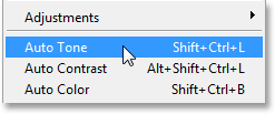 Selecting the Auto Tone command in Photoshop CS6. Image © 2013 Photoshop Essentials.com