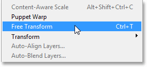 Selecting the Free Transform command from under the Edit menu. Image © 2013 Photoshop Essentials.com