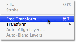 Cara memilih perintah Free Transform di Photoshop. Image © 2009 Photoshop Essentials.com.