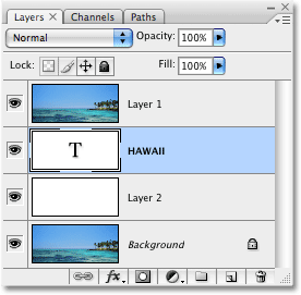 La capa de texto ahora aparece bajo "Capa 1" en la paleta Capas. Imagen © 2008 Photoshop Essentials.com.