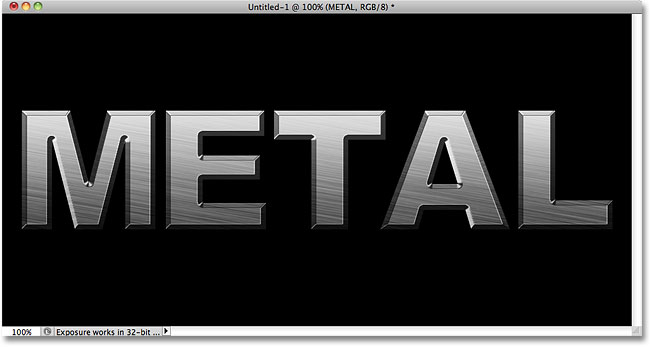 Металлический текстовой эффект после применения стилей слоя. Image © 2010 Photoshop Essentials.com.