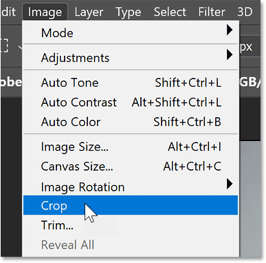 Selecting the Crop command from the Image menu in Photoshop.