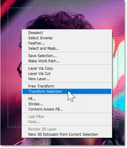 Right-clicking in the selection outline and choosing Photoshop's Transform Selection command.