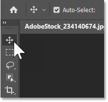 Selecting the Move Tool from Photoshop's toolbar.