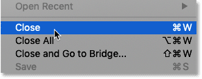 Choosing the Close command from Photoshop's File menu.