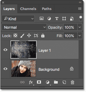 The Layers panel showing both photos in the same document in Photoshop.