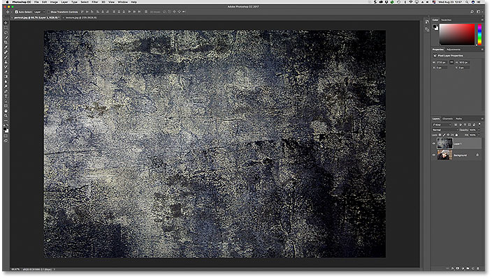 The texture image has been pasted into the portrait photo's document in Photoshop.