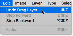 Choosing the Undo Drag Layer command from the Edit menu in Photoshop.