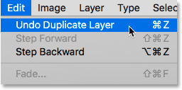 Choosing the Undo Duplicate Layer command in Photoshop.