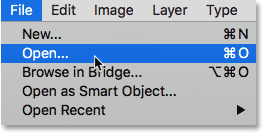 Choosing the Open command from under the File menu. Image © 2016 Steve Patterson, Photoshop Essentials.com