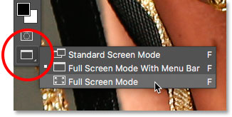 Selecting Full Screen Mode from the Toolbar in Photoshop. 