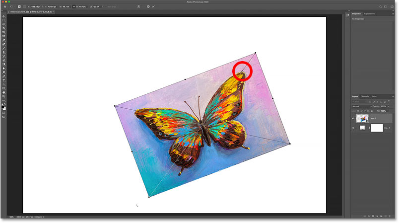 Rotating the image around the new Free Transform Reference Point in Photoshop