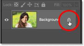 Unlocking the Background layer by clicking the lock icon in Photoshop's Layers panel