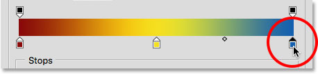 Selecting the blue color stop in the gradient. Image © 2015 Steve Patterson, Photoshop Essentials.com