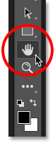 Selecting the Hand Tool from the Tools panel in Photoshop. 