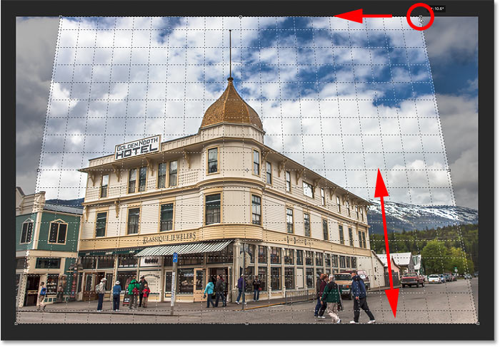 Matching the perspective grid line with the right side of the building to correct perspective in the image