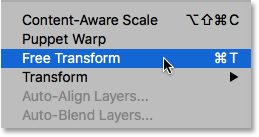 Sélectionner la commande Transformation libre sous le menu Édition. Image © 2016 Photoshop Essentials.com