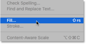 Selecting the Fill command from under the Edit menu. Image © 2016 Photoshop Essentials.com