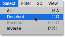 Choosing the Deselect command from under the Select menu. Image © 2016 Photoshop Essentials.com