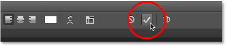 Clicking the checkmark to accept the text in Photoshop.