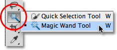 Selecting the Magic Wand Tool from the Tools panel in Photoshop. 