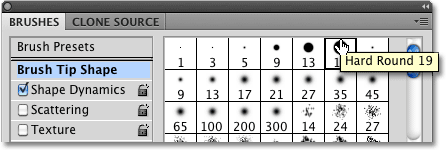 Choosing the Hard Round 19 pixel brush from the Brushes panel in Photoshop. 