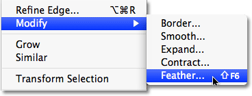 Choosing the Feather command in Photoshop CS4. 