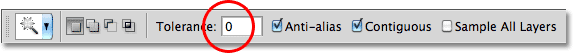Increasing the Magic Wand Tolerance value in Photoshop. Image © 2010 Photoshop Essentials.com