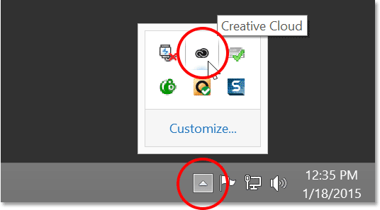 The Creative Cloud icon in the notification area of the taskbar in Windows.